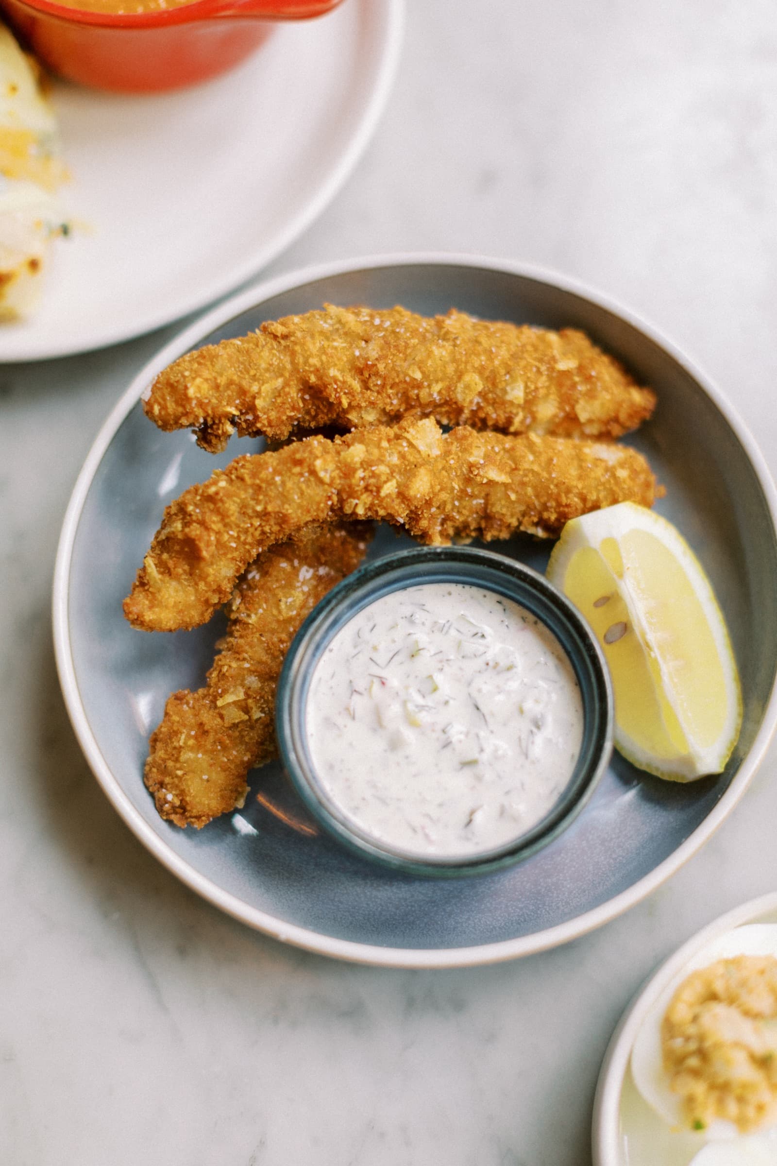 Potato chip-crusted fish sticks with tartar sauce