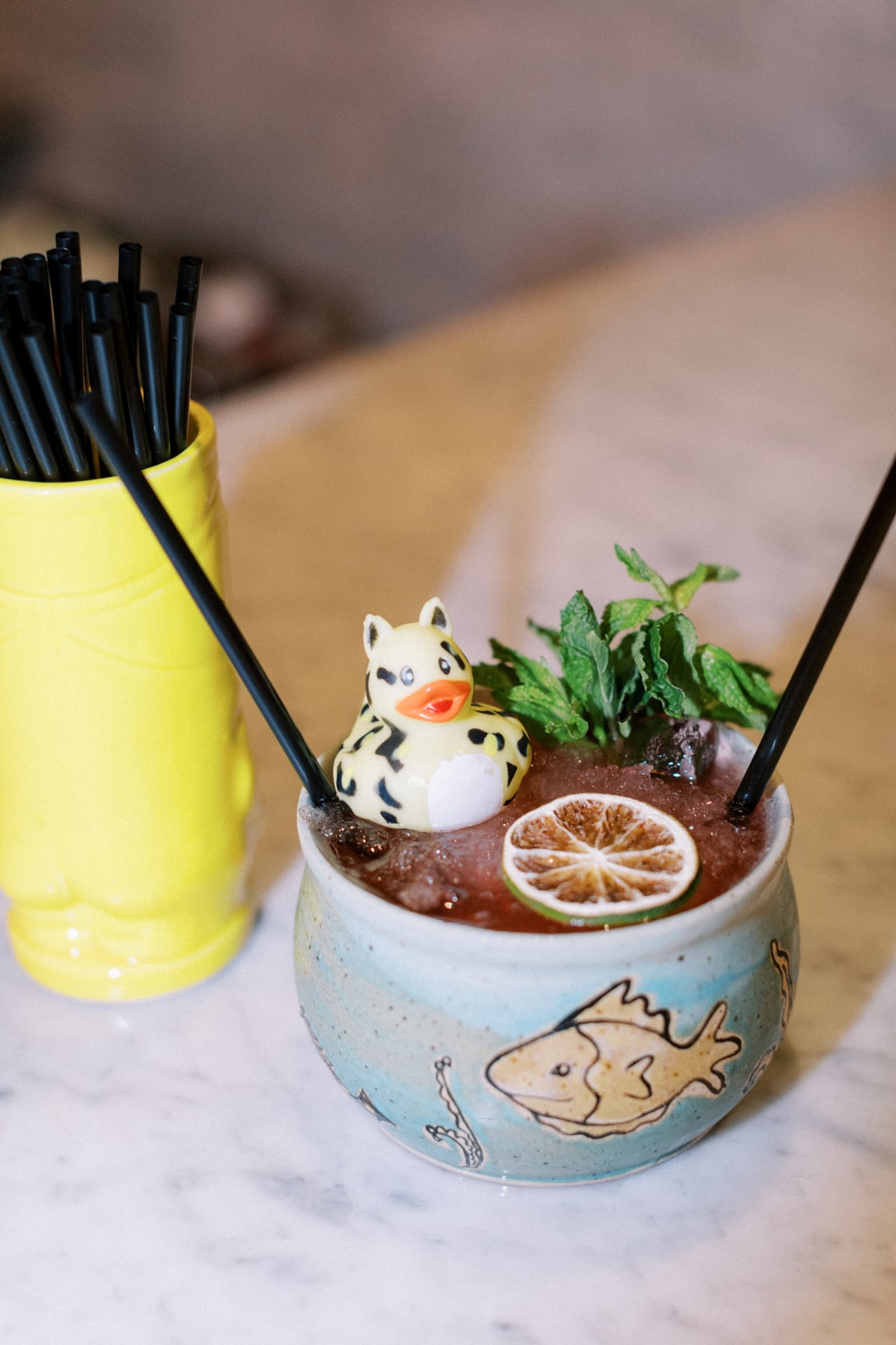 Signature cocktail served in a handmade ceramic mug
